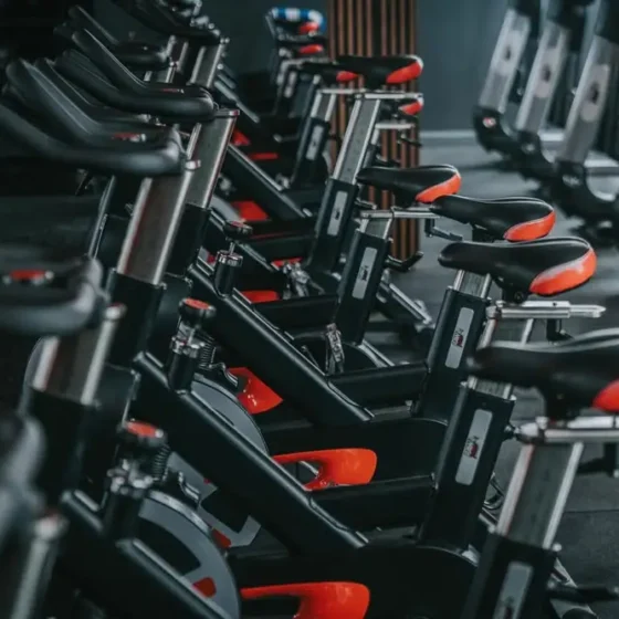 Spin bikes lined up on the floor